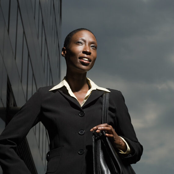 Businesswoman and a cloudy sky